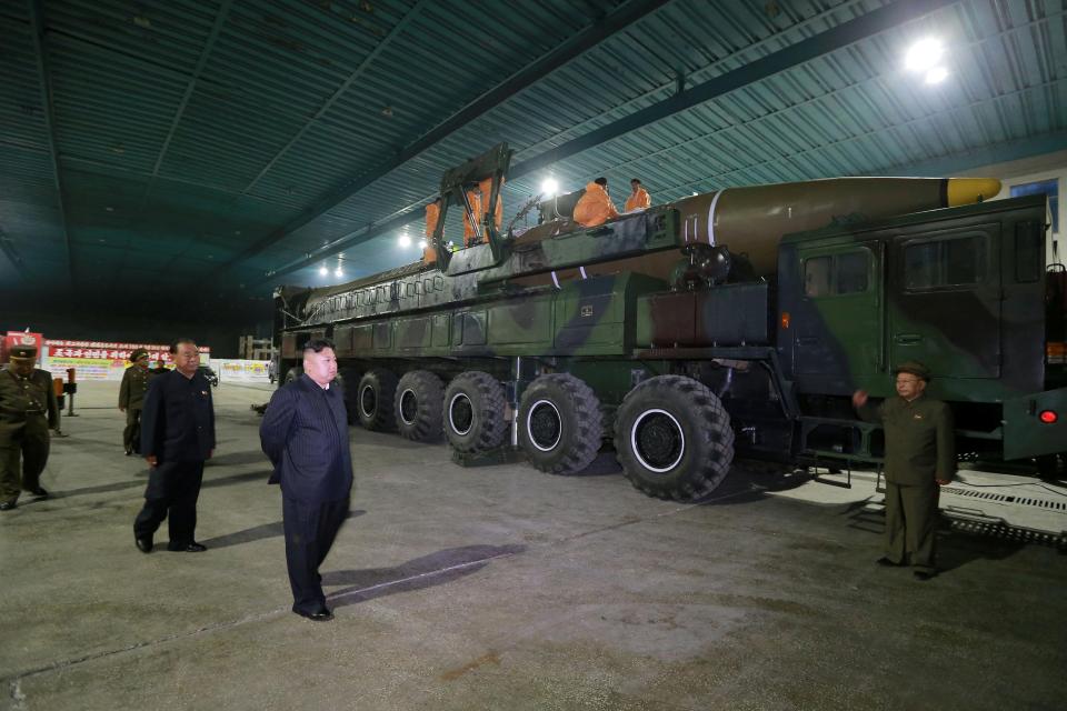  Man obsessed ...Kim Jong-un takes a moment to inspect his beloved ballistic rocket