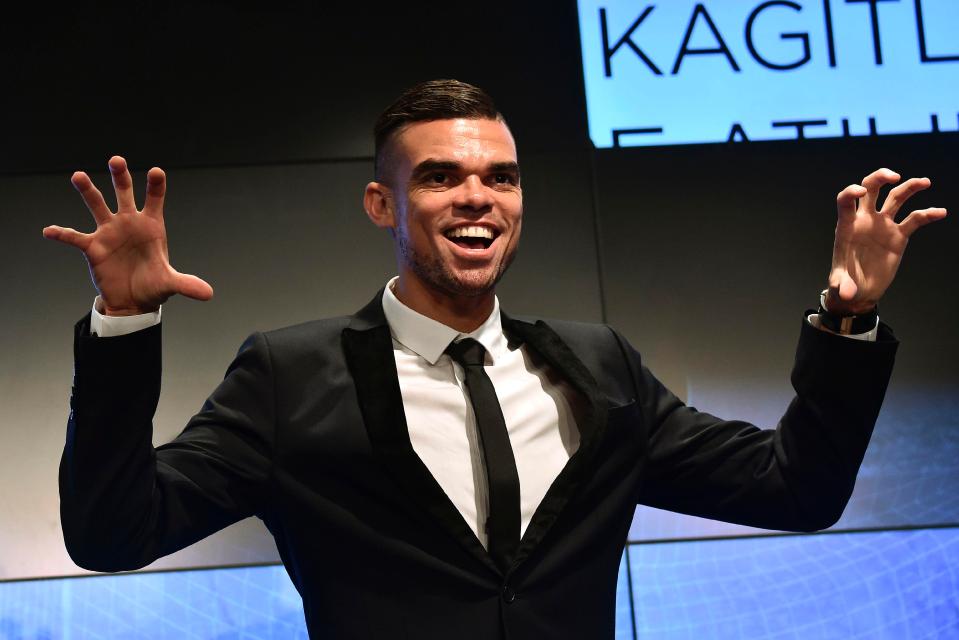  Pepe does his trademark pose as he is unveiled at Besiktas