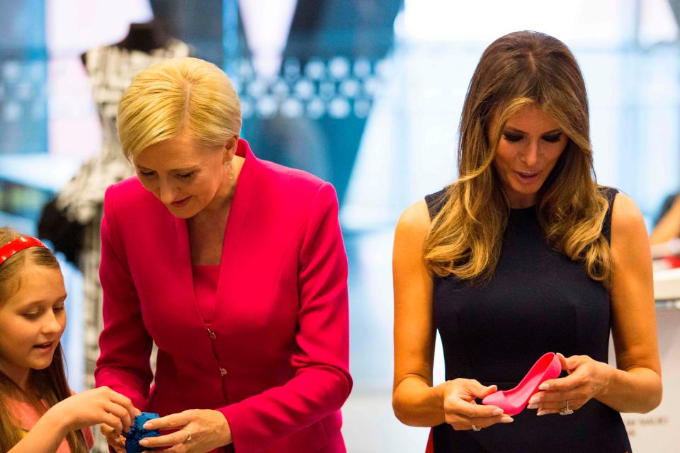  First Lady Melania Trump and Polish President's wife Agata Kornhauser-Duda show shoes printed by children on a 3D printer as they visit the Copernicus Science Center in Warsaw