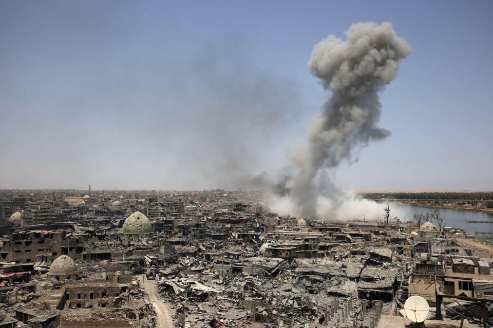  Smoke billowing from the site of a bomb drop in Mosul by coalition forces on Sunday morning