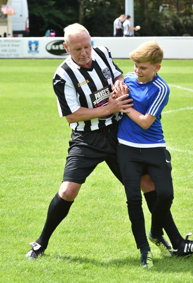  Paul Gascoigne tussles with a local lad during the Newcastle-based match