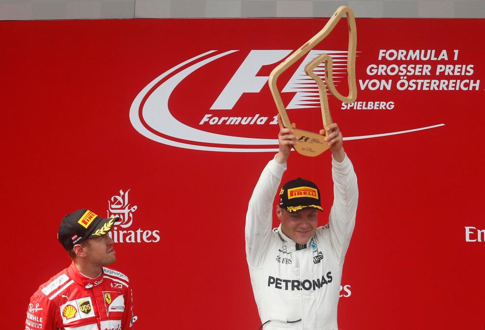  Valtteri Bottas proudly lifted the winner's trophy on the podium