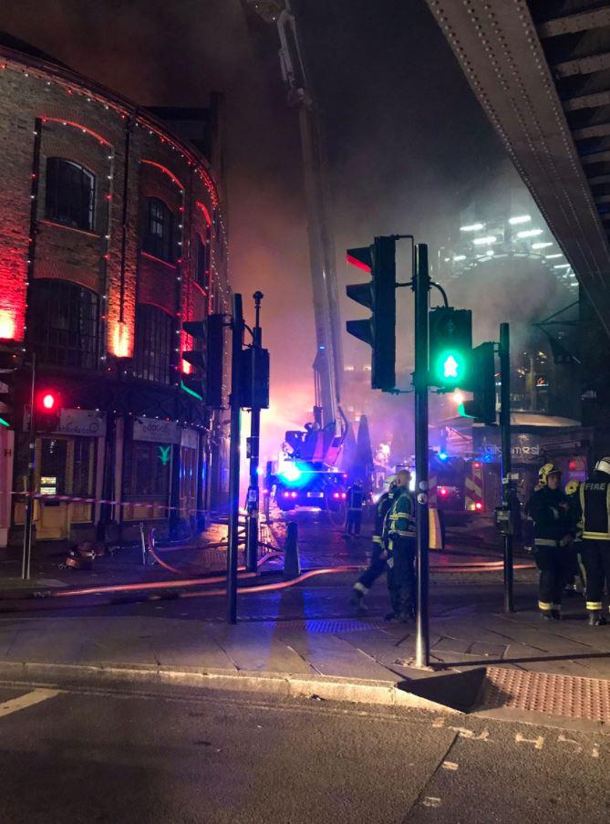  Firefighters have said three storeys of one building were alight