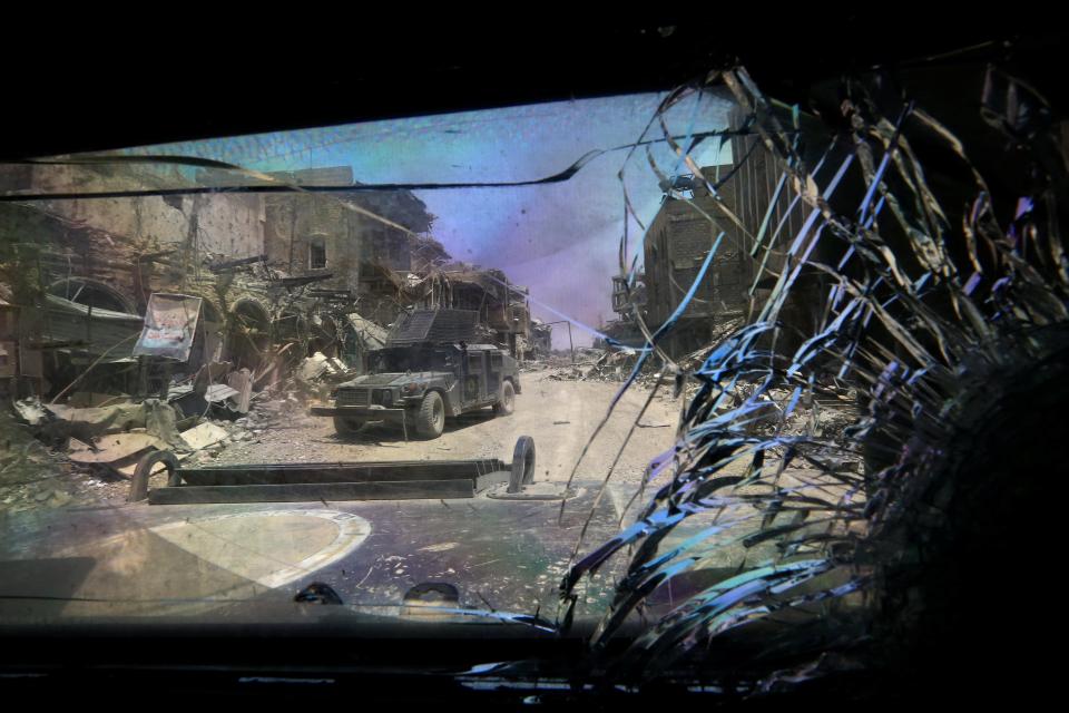  Military vehicle of Iraqi Counter Terrorism Service (CTS) seen through another military vehicle in the Old City of Mosul yesterday