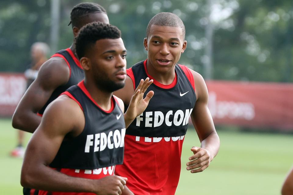  Kylian Mbappe has a chat with pals during Monaco's pre-season training camp