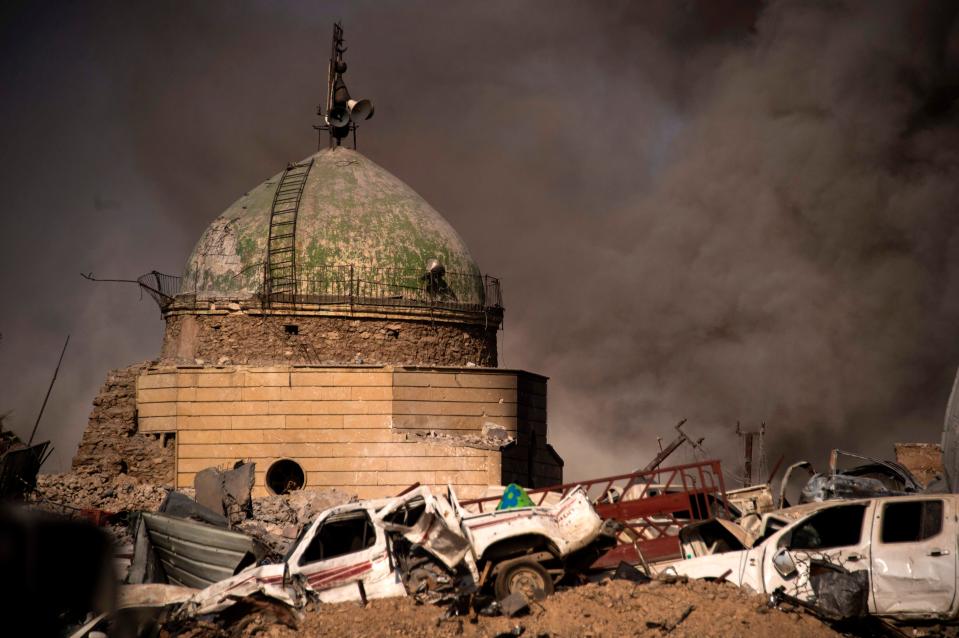  Destroyed vehicles lay amongst the rubble in the Old City of Mosul