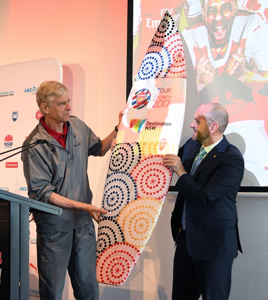 Arsenal landed in Sydney before Arsene Wenger was presented with a surf board