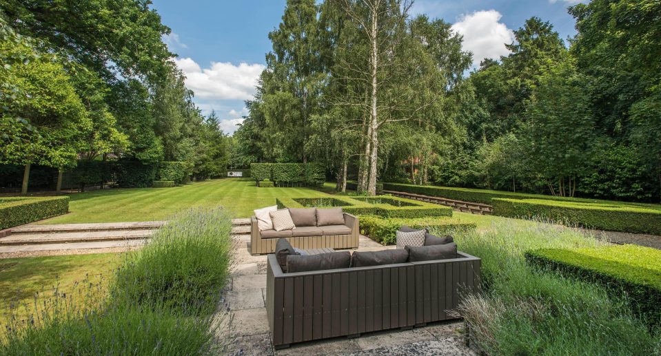  A south-facing sun terrace leads to lawn area