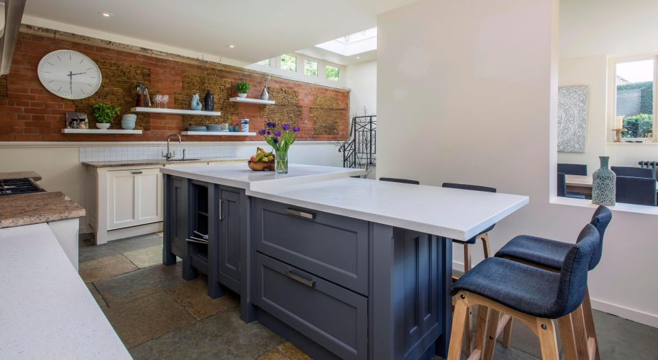  The kitchen continues a light and airy theme with a skylight over the dining area