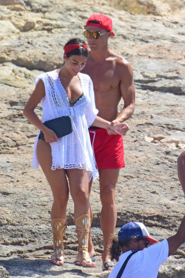  Cristiano Ronaldo helps pregnant girlfriend Georgina Rodriguez along on the beach