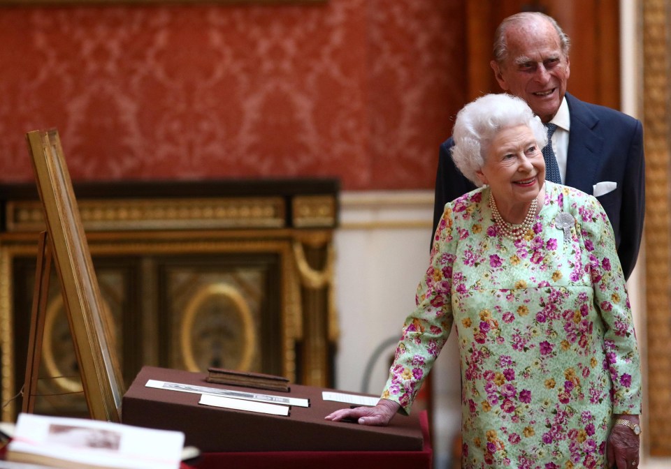 The Queen and Prince Philip smile as they show the Spanish Royal Family around Buckingham Palace