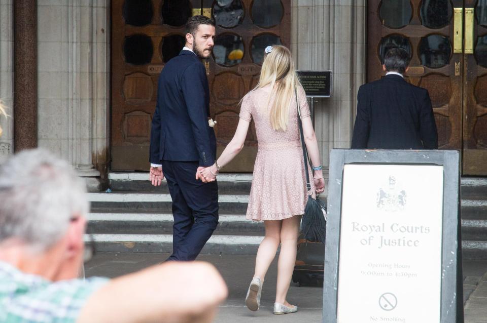  Chris and Connie hold hands as they arrive at the High Court this morning