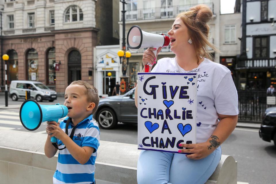  Protesters outside the High Court where the hearing is taking place today