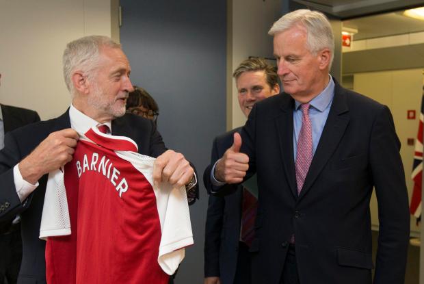 Jeremy Corbyn gave the EU's Brexit negotiator an Arsenal shirt when they met in Brussels today