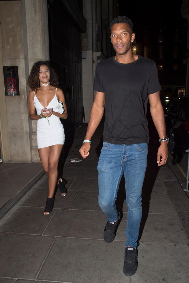 Love Island’s Theo Campbell looked smug as he partied in London with a mystery woman