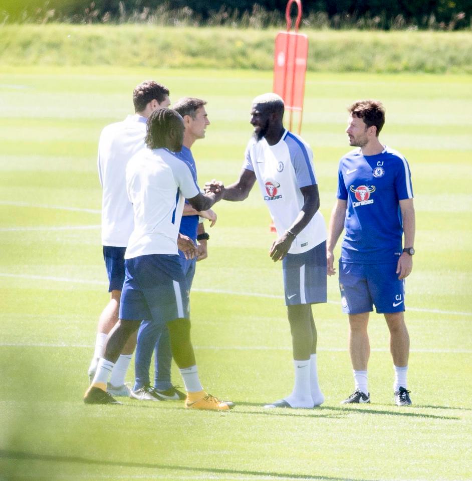  Tiemoue Bakayoko shakes hands with Victor Moseas as he meets his new colleagues during the session at Cobham