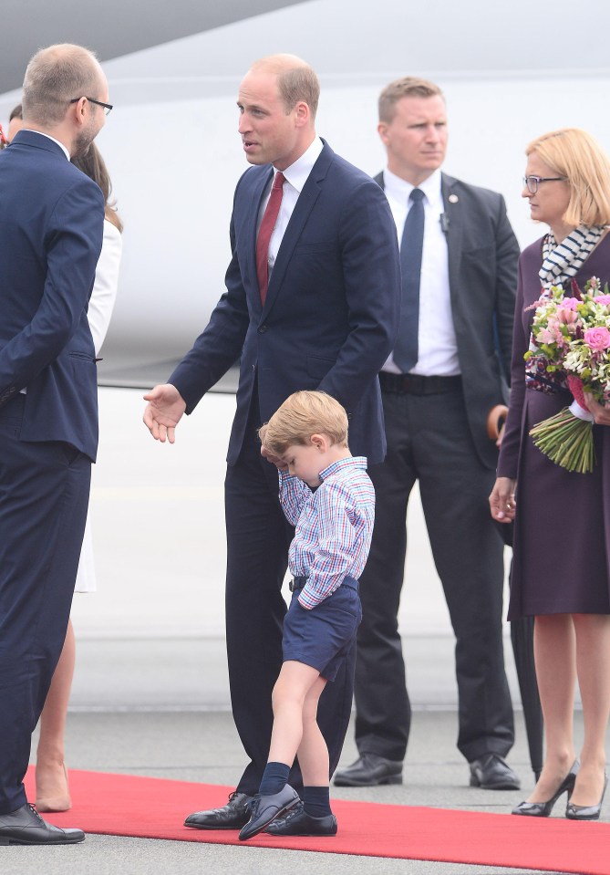  George looks bored as his dads greets dignities after disembarking the private jet