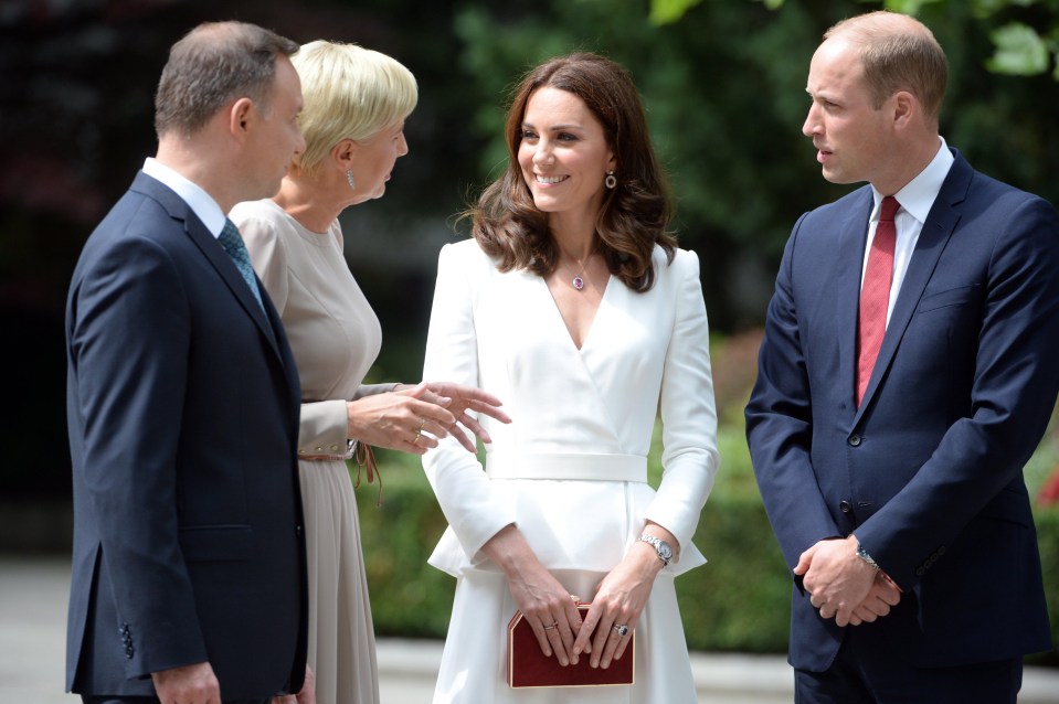  Polish president Andrzej Duda and his wife speak to the Duke of Duchess of Cambridge during a walk in the Presidential Palace's garden