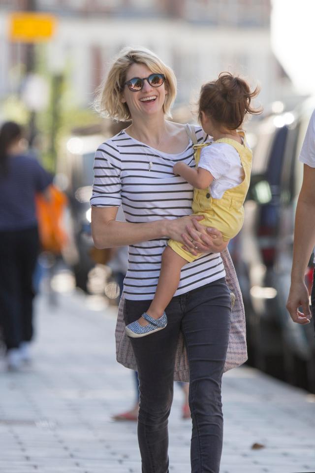  Jodie laughed as she stepped out with her young daughter yesterday