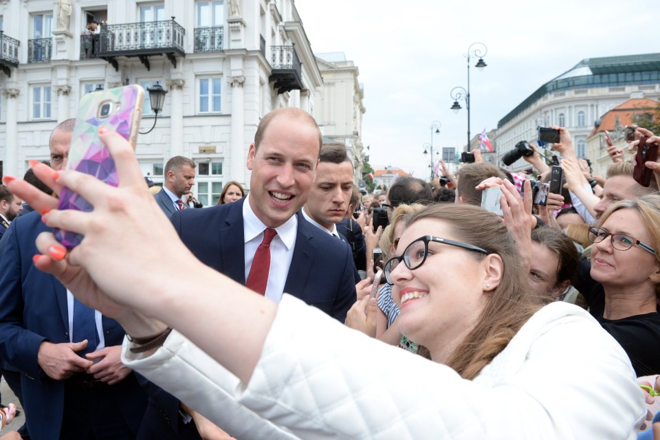  Prince William poses for a selfie with fans outside the presidential palace on the first day of the tour