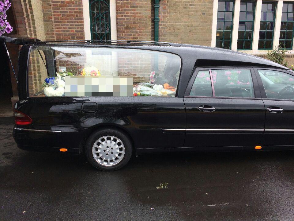  Hearse curse ... tribute flowers spelling out swear word shock mourners at funeral