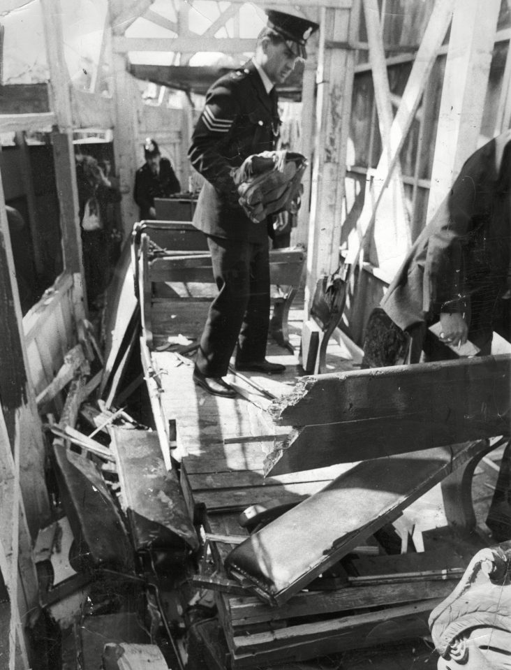  Police inspect the smashed remains of the wooden Big Dipper ride in Battersea Park in 1972