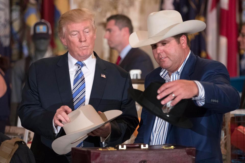  Donald Trump tries on the hats with Stetson boss Dustin Noblitt