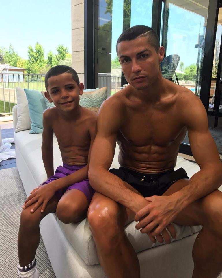  Cristiano Ronaldo poses for a picture with seven-year-old son Cristiano Jr