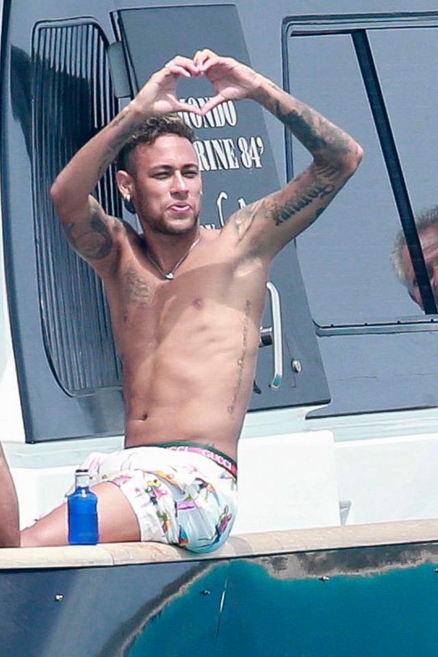  Neymar had little care in the world as he relaxed with friends in Ibiza on Tuesday