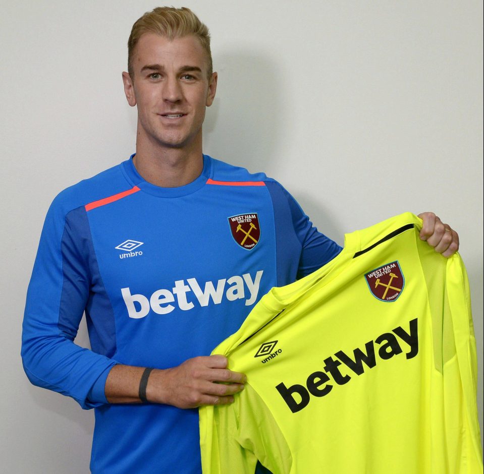  Hart poses with the two keepers' jerseys he'll be donning next season