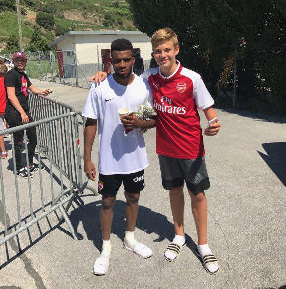  Thomas Lemar has been snapped posing next to an Arsenal shirt-wearing fan