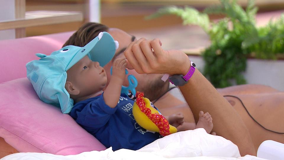  Father and son hung up by the pool during the challenge