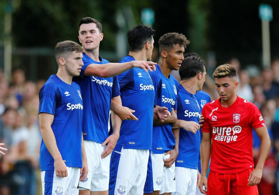  Michael Keane organises the Everton wall as they face a free kick