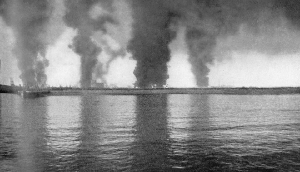  This photo, taken from onboard a destroyer, shows the coast of Dunkirk aflame