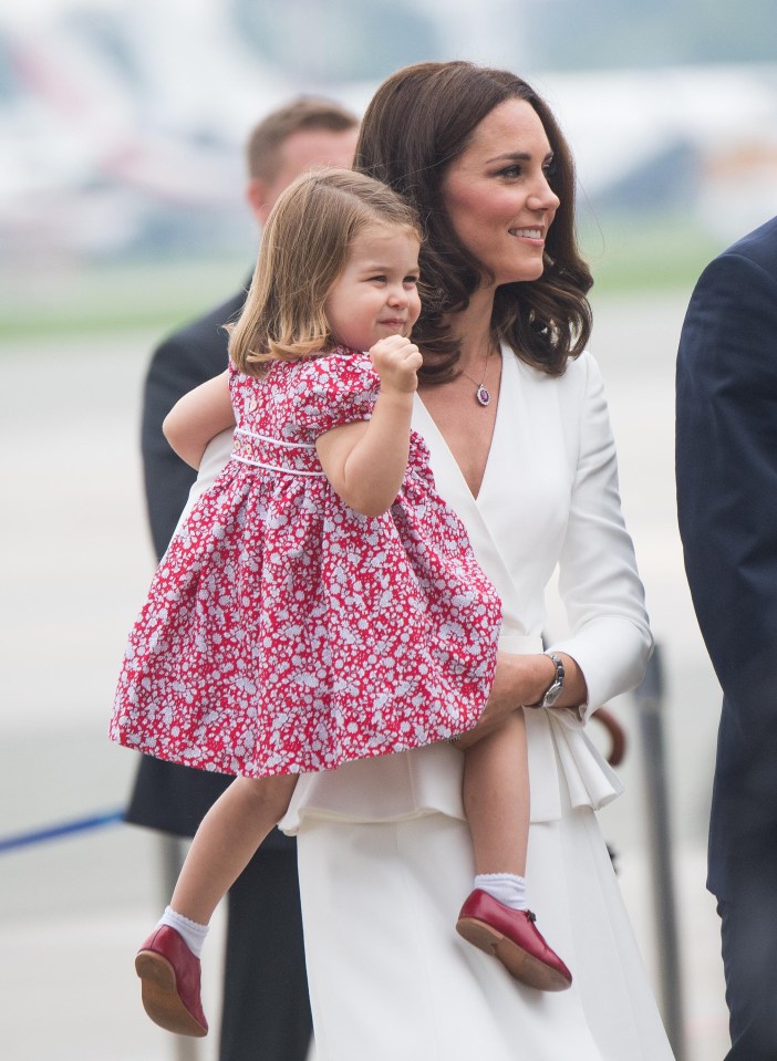 Princess Charlotte, pictured with mum Kate, has been spotted wearing a pair of red buckled shoes that once belonged to Prince Harry