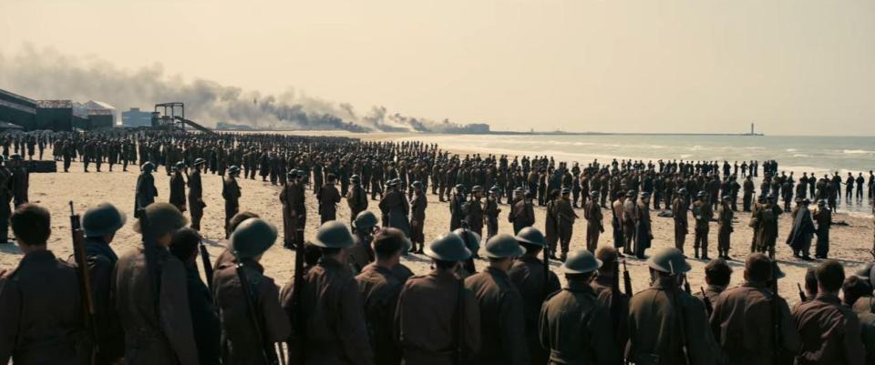  A scene from Christopher Nolan's epic shows troops lining up in formation on a Normandy beach as they await rescue