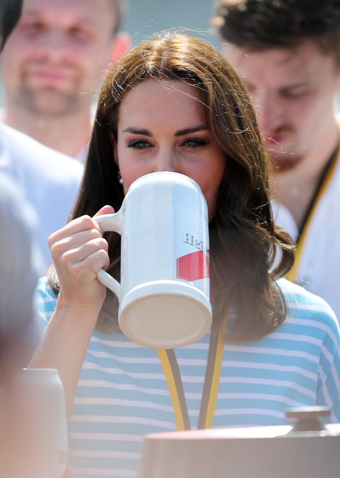 Kate, who joked  this week about wanting more babies, took  a pretend sip before passing her stein to another rower