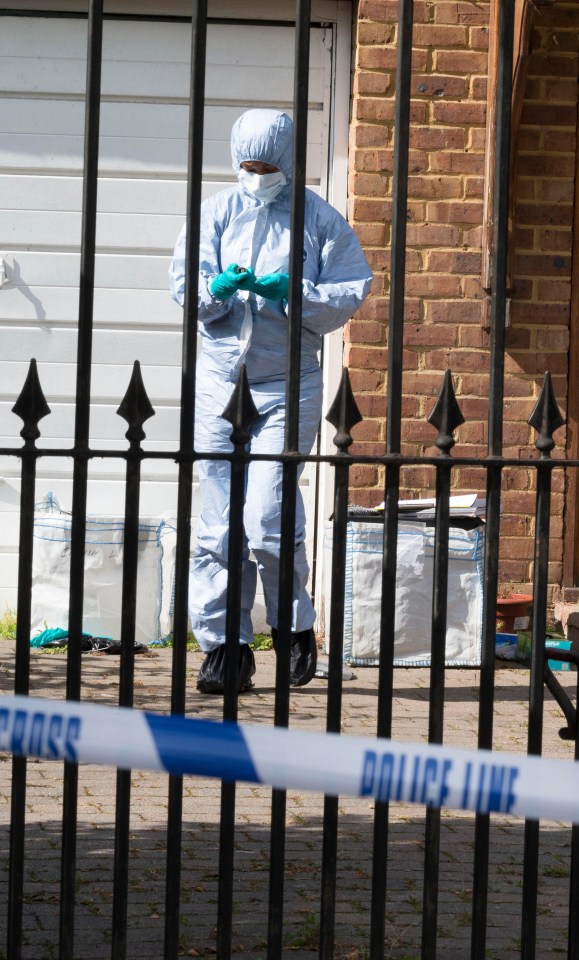 Forensics officers were on the scene after a woman's body was discovered last night