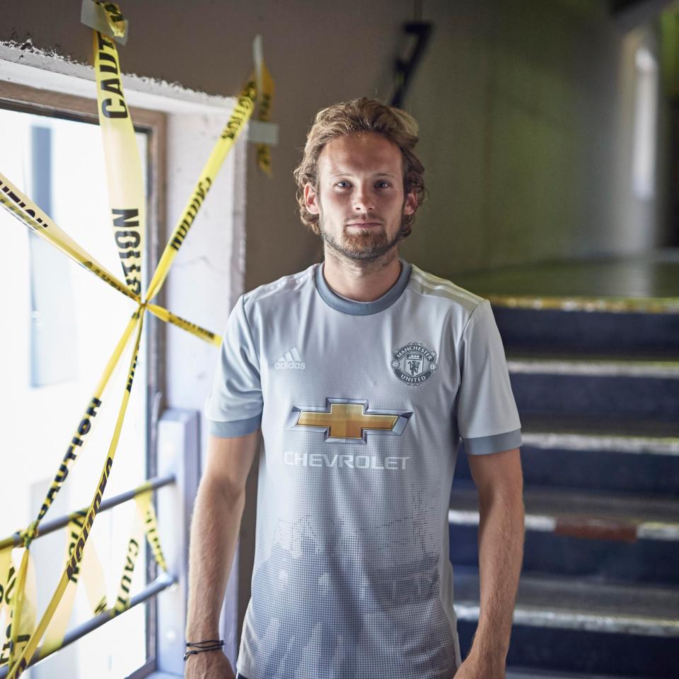  Daley Blind models the new third kit for the 2017/18 season which features a silhouette of the 'Holy trinity' statue