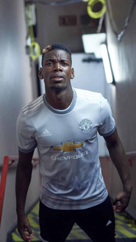  French midfielder Paul Pogba models the new Manchester United third kit