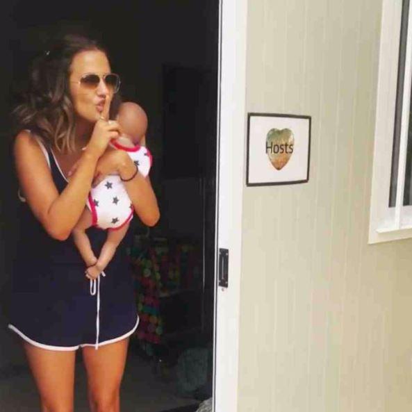  Love Island's Caroline Flack cradles Britain's most famous baby, Cash Hughes