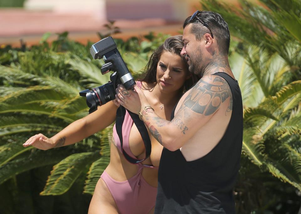  The reality star almost suffered a wardrobe malfunction as she scrutinised the shots