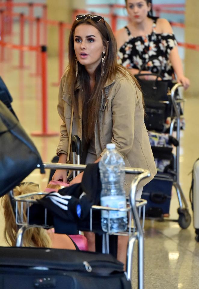  Winner Amber looked tired as she waited around for the plane