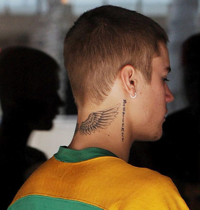 The popular pop star has angel wings tattooed on the back of his neck