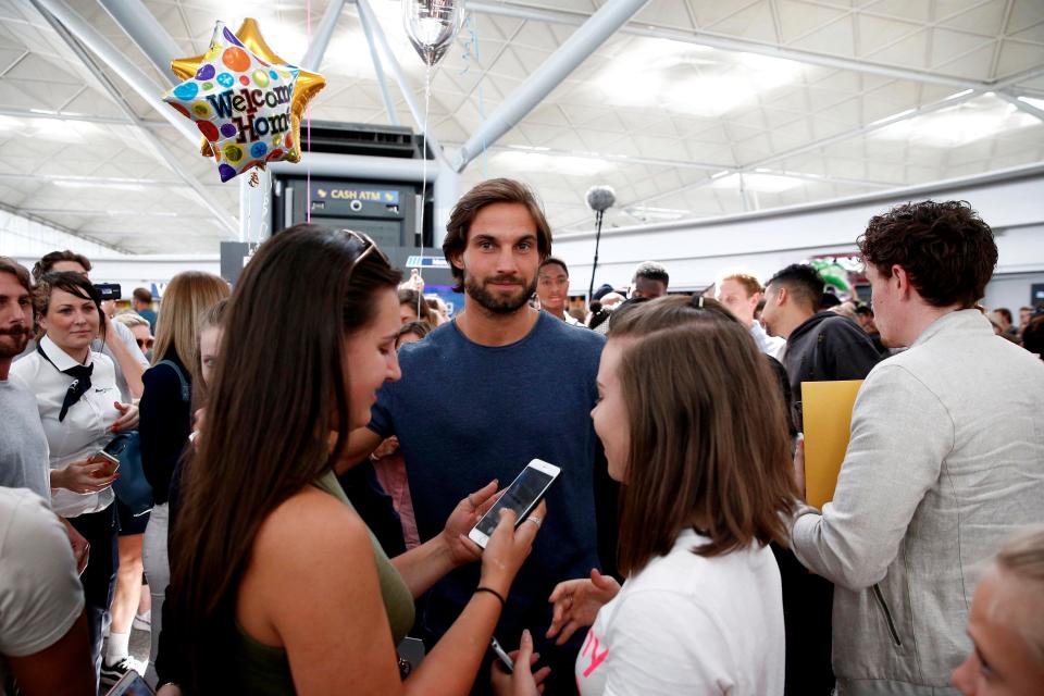  Jamie Jewitt was the centre of attention after stepping off the plane