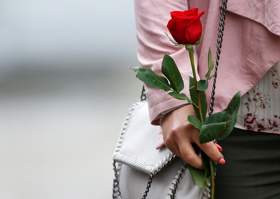 Mourners were asked to bring a single red rose in tribute