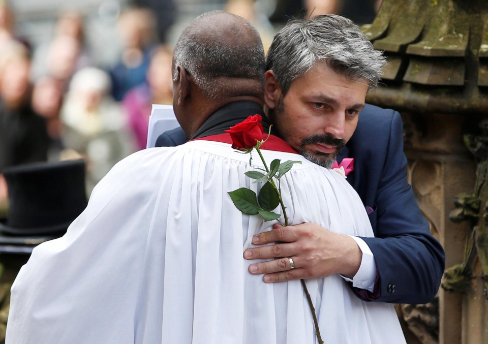 Rev Rogers Govender, Dean of Manchester, comforted Saffie’s dad before the service