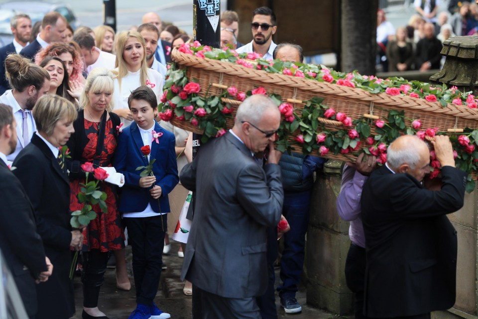 Saffie's mum Lisa, wearing a rose dress, and still in a sling from the injuries sustained in the attack, stood by her son Xander as the funeral was carried into the Cathedral