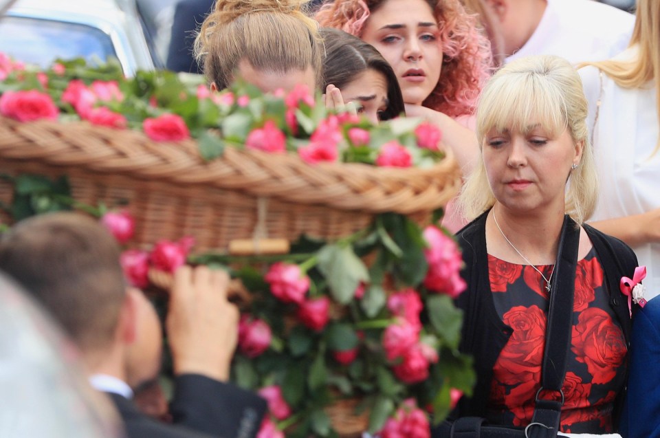 Saffie’s mum Lisa (far right) alongside her daughter’s coffin