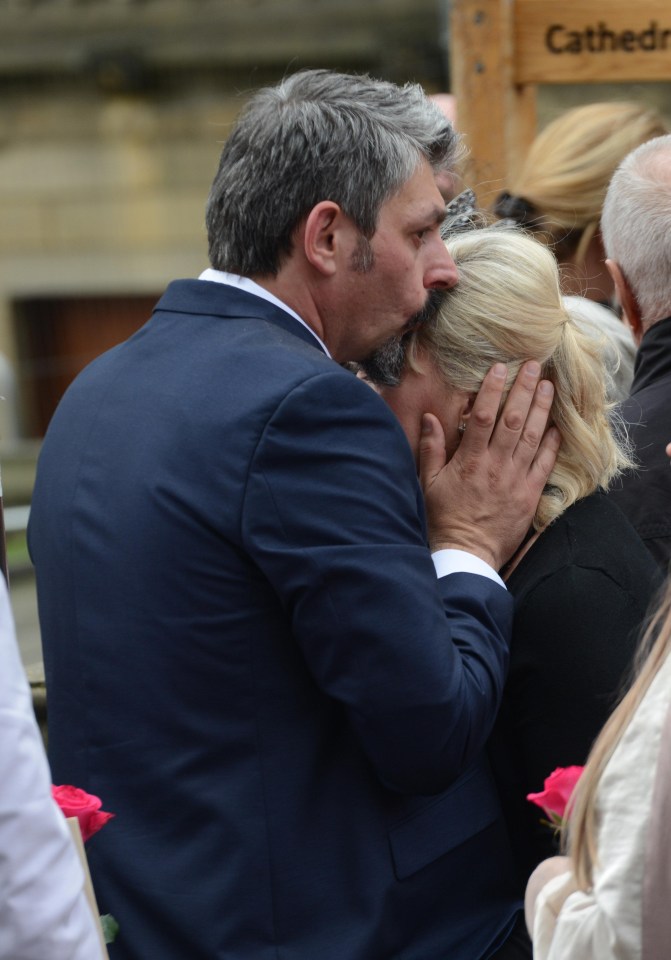 He planted a tender kiss on the forehead of his wife who is still recovering from injuries she sustained in the attack which killed her daughter